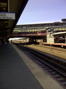 Manhattan, thatta way.  Waiting at the train station in Queens...